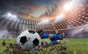 Fotbollsspelare som slänger sig på bollen